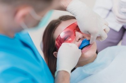 Dental team member receiving fluoride treatments