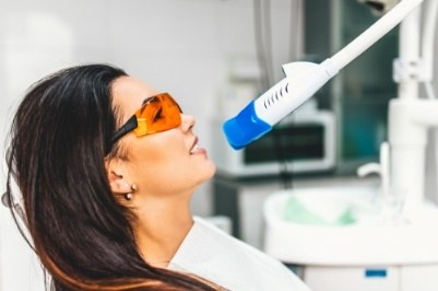 Woman receiving teeth whitening