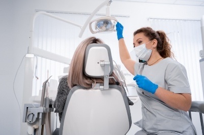 Dental team member explaining the cost of ental emergency treatment