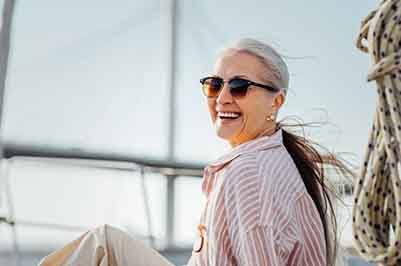 Woman smiling while sitting on her boat