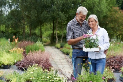 Older couple with healthy smiles after dental implants