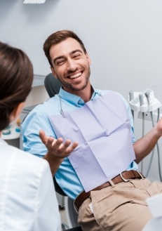 Man smiling at dentist during dental appointment