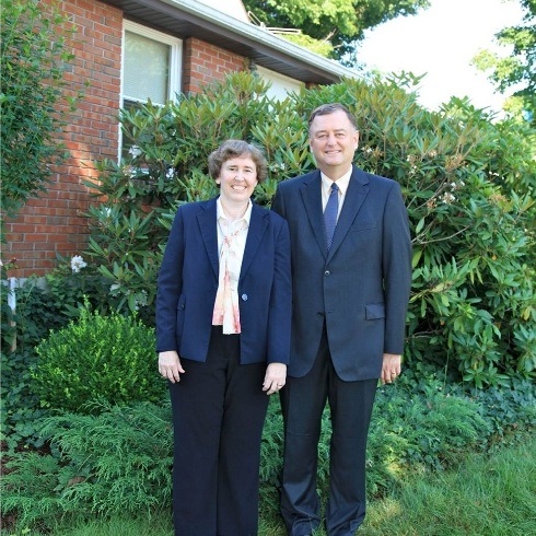 Doctors Carolyn and Walter McGinn outside the dental office