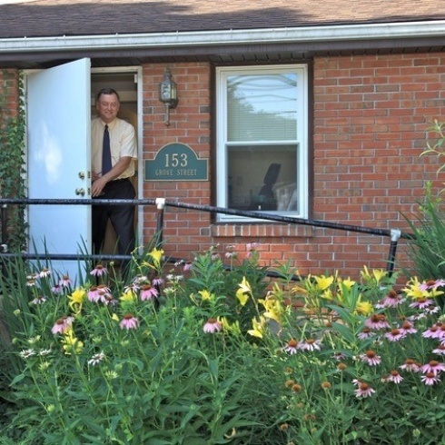 Doctor McGinn outside the dental office