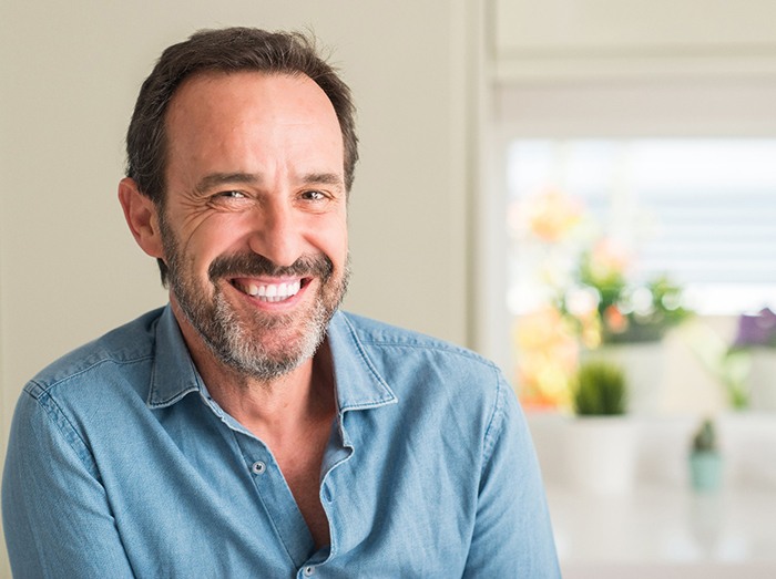 man smiling after full mouth reconstruction