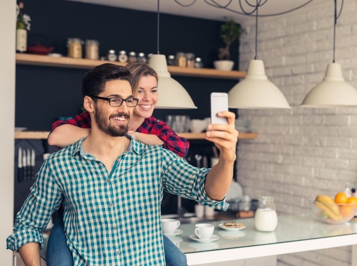 Man and woman smiling after receiving advanced dental services and technology