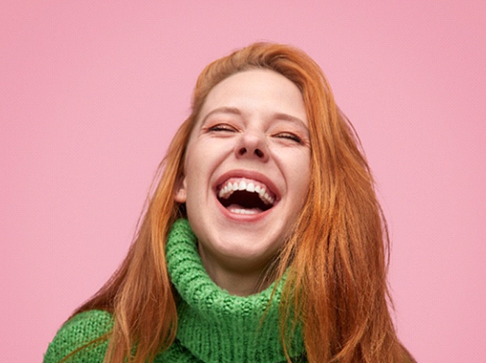 woman laughing with tooth-colored fillings in Putnam