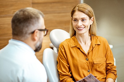 Dentist discussing veneers with a female patient