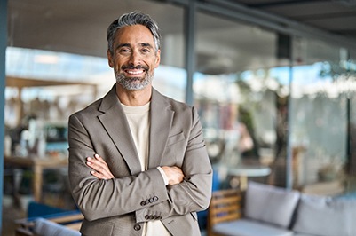 Male professional smiling at work