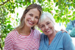 smiling mother and daughter