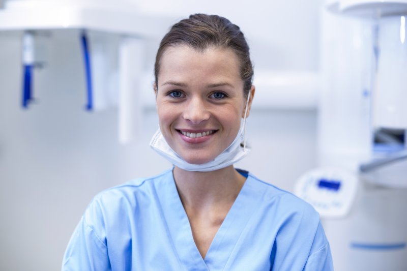 Smiling dental hygienist in dental practice