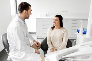 dentist talking to patient