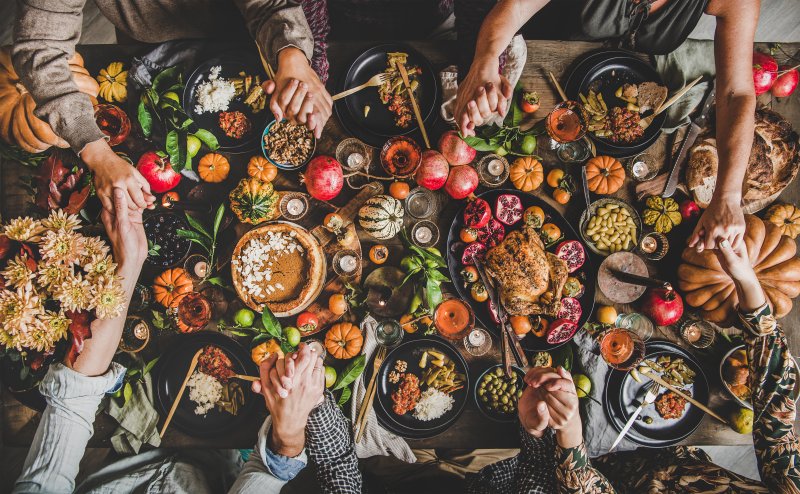 A family enjoying holiday food while conscious of their dental health