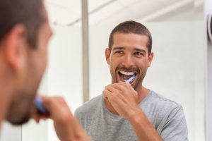 Man brushing teeth